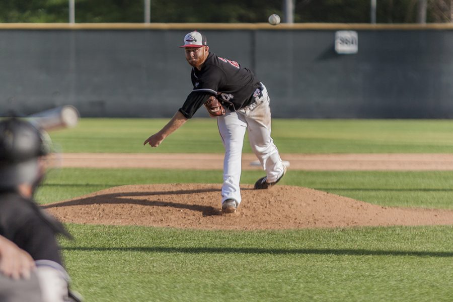 Senior Garrett Picha pitching during the home game against Westmont on Feb. 14 | Aaron Fooks/THE CHIMES
