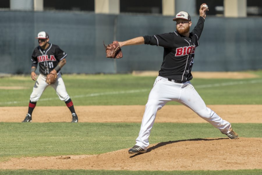 Senior pitcher Garrett Picha winds up the ball to pitch during the game this weekend. Biola drops game one to San Diego Christian on Friday. | Cherri Yoon/THE CHIMES
