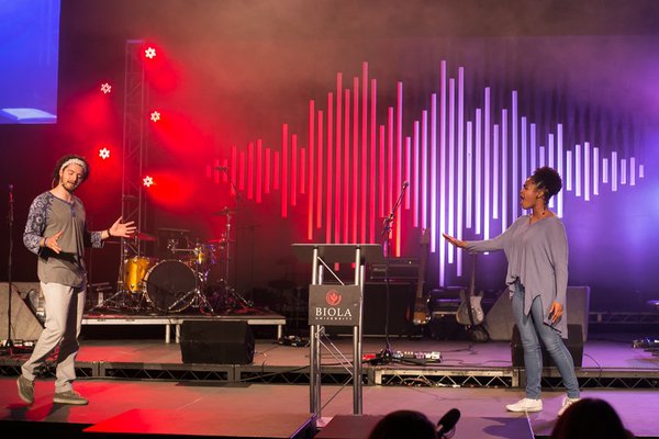 Session 3 opens with a spoken word performed by Stefan Vandenkooy & Hailey Mayweather. | Anna Warner/THE CHIMES