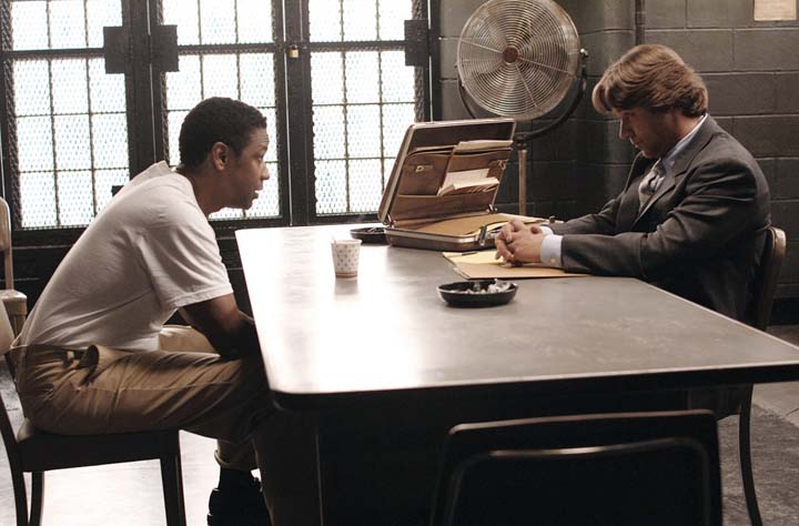 Denzel Washington (left) and Russell Crowe face off in Ridley Scott’s new crime drama, “American Gangster.”