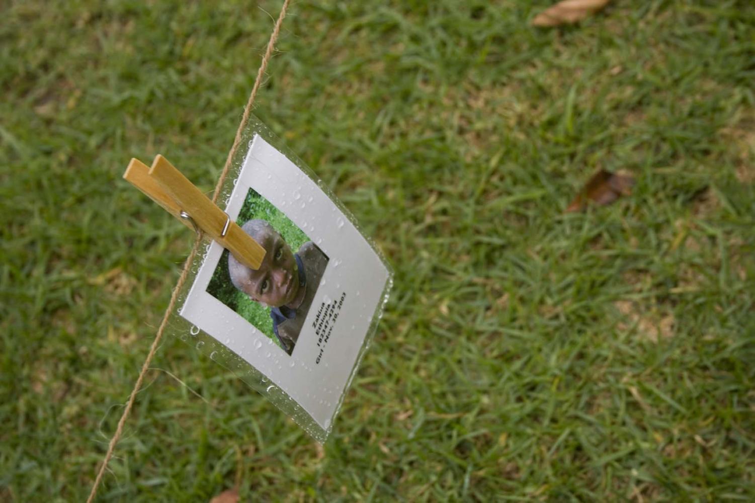 Hundreds of portraits were strung across Metzger Lawn Friday. The display, commemorating Saturday's World AIDS Day, was coordinated by Biola's Social Justice Ministry.