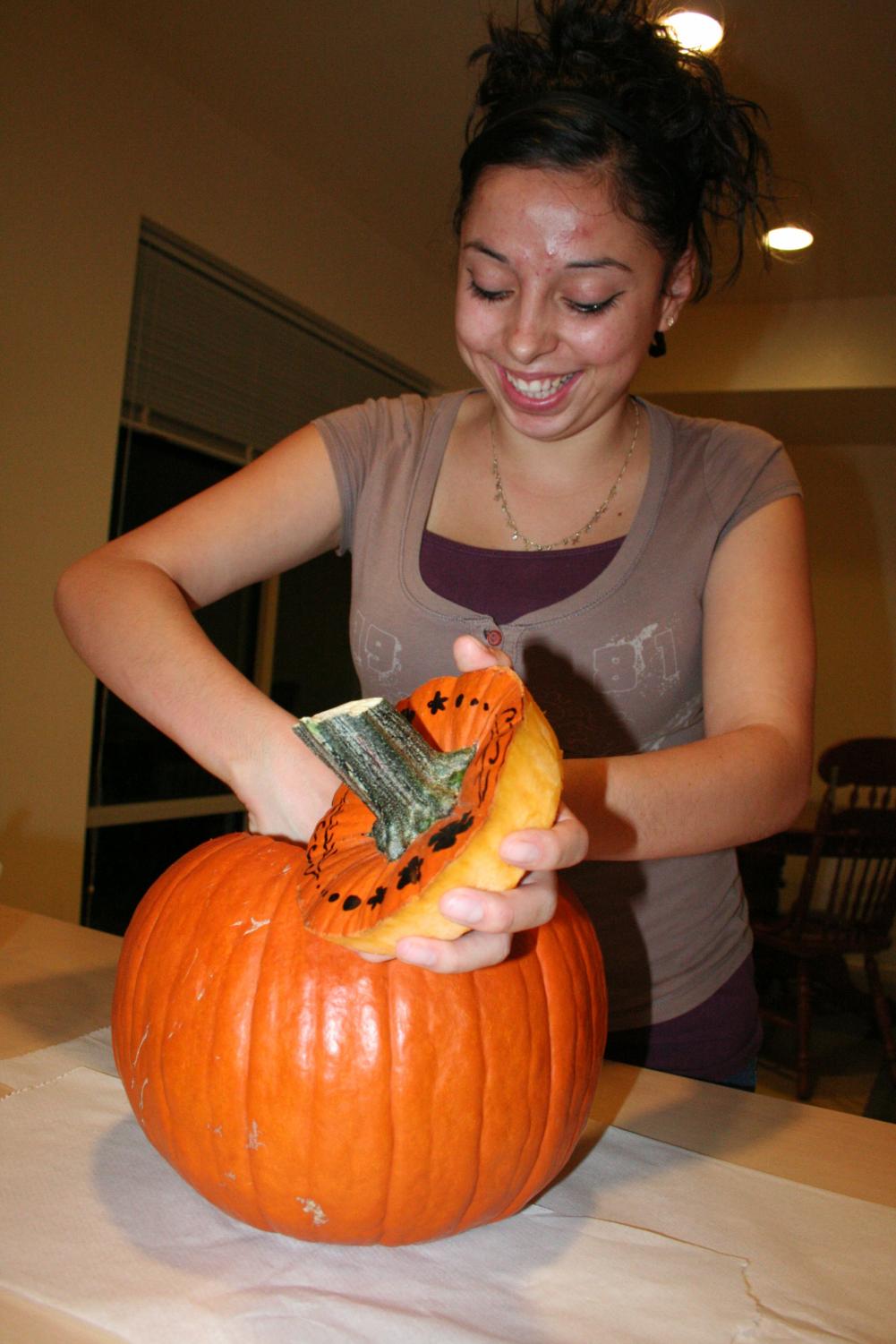 Alyssa Morales of Hope works on carving a pumpkin for Friday's contest.