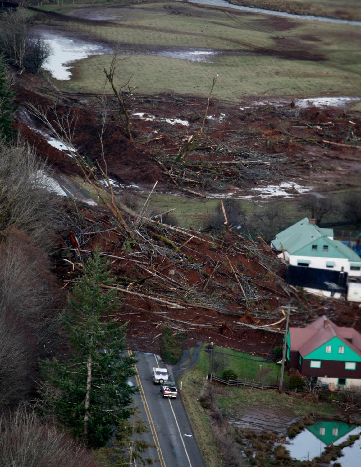 A slide over Hwy. 6 in Lewis County Wash., still blocks the road on Saturday, Dec. 8, 2007. Washington Gov. Chris Gregoire has requested federal disaster declaration for the two Washington counties that were hit by hardest by storms and flooding earlier in the week.