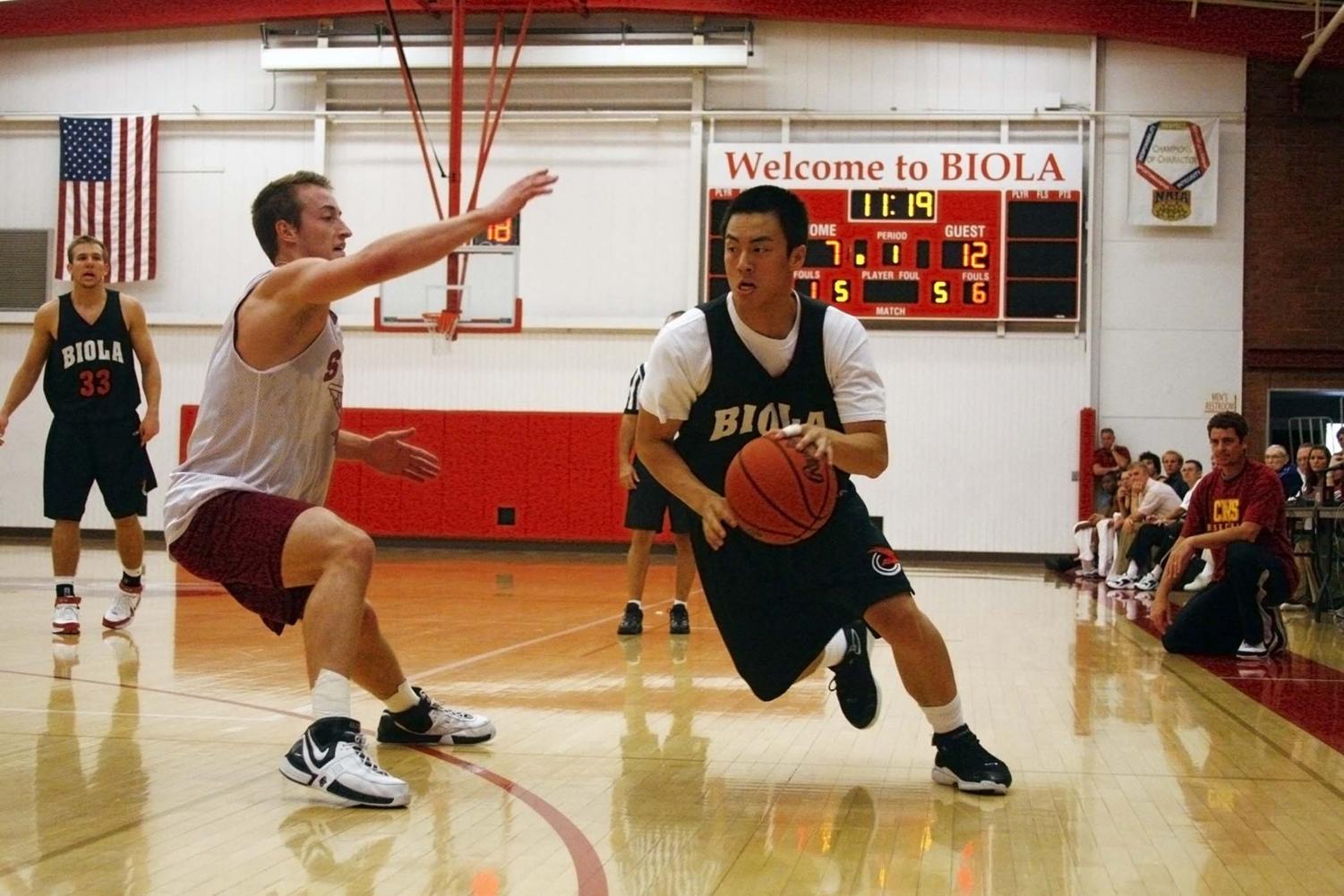 Junior guard Larry Tieu (2) heads down the court toward the basket. Biola dominated Redlands with a 79-55 win in a non-conference game on Saturday in Redlands, CA.