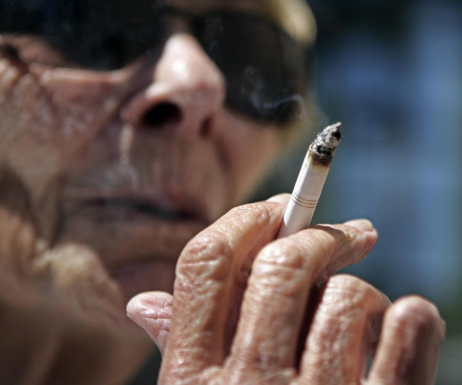 Helen Heinlo smokes outside of a coffee shop in Belmont, Calif., June 11, 2007.