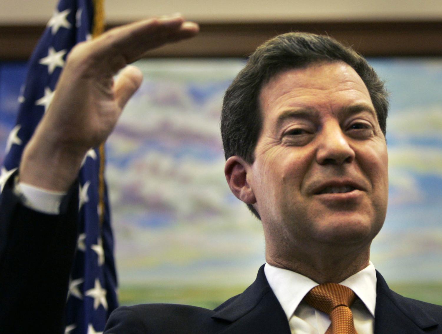 Sen. Sam Brownback, R-Kan., answers questions during a news conference at the State House in Topeka, Kan., Friday, Oct. 19.