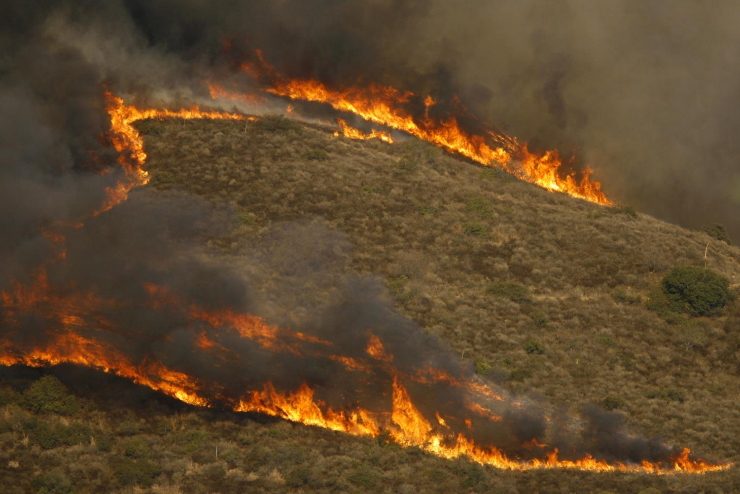 Lines of fire spread along the Santiago Canyon hills Tuesday, Oct. 23, 2007, in Silverado, Calif. Mandatory evacuations are in place for for the canyon areas northeast of Santiago Canyon Road between