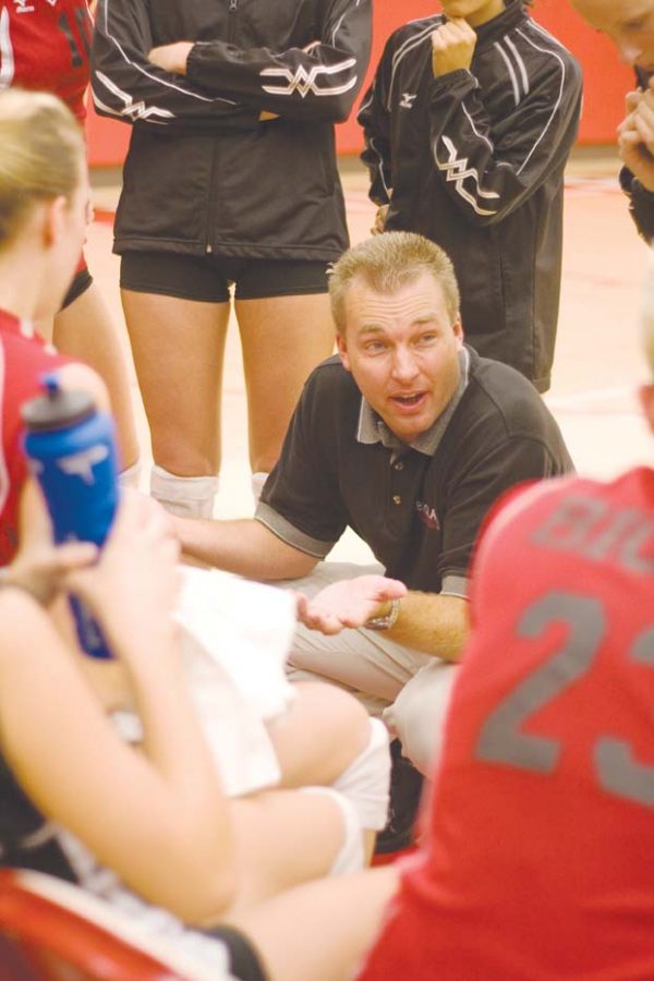 Coach Aaron Seltzer encourages the ladies volleyball team on their Tuesday matchup with rival Azusa Pacific. The team won the game.