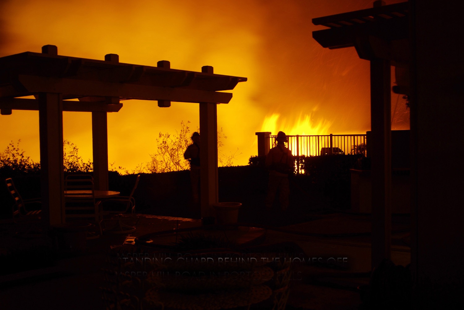 Flames inch towards homes in Portola Hills on Monday night.