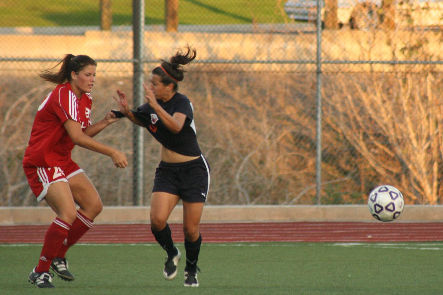 Sophomore defender Heather Moseley fouls Fresno Pacific opponent on Tuesday during an intense fight for the first goal. The game went into double overtime with a final score of 0-0