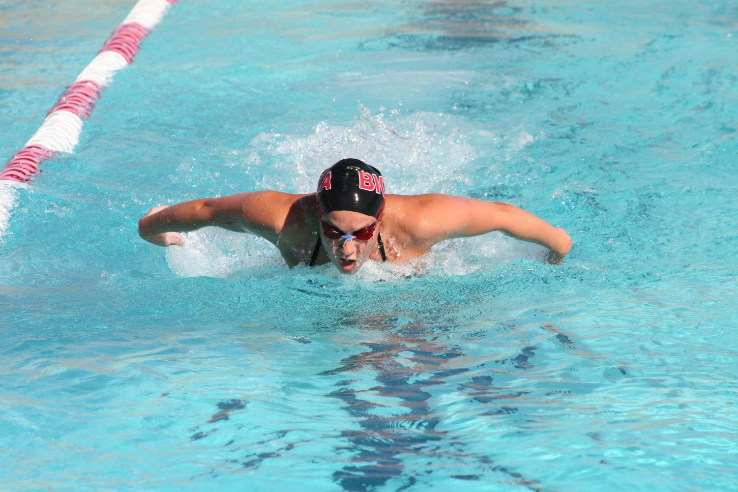 Senior Christina Piakak competes in the butterfly stroke during last week's pentathlon swim meet. Piakak also competes freestyle.