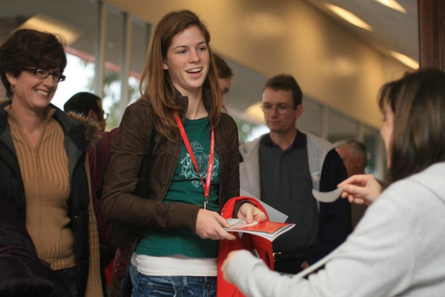 Nicole Riha (middle), 17, is one of many prospective students who attended Biola’s University Day with family members. Aimee Tangeman (below) prepares to give a tour.