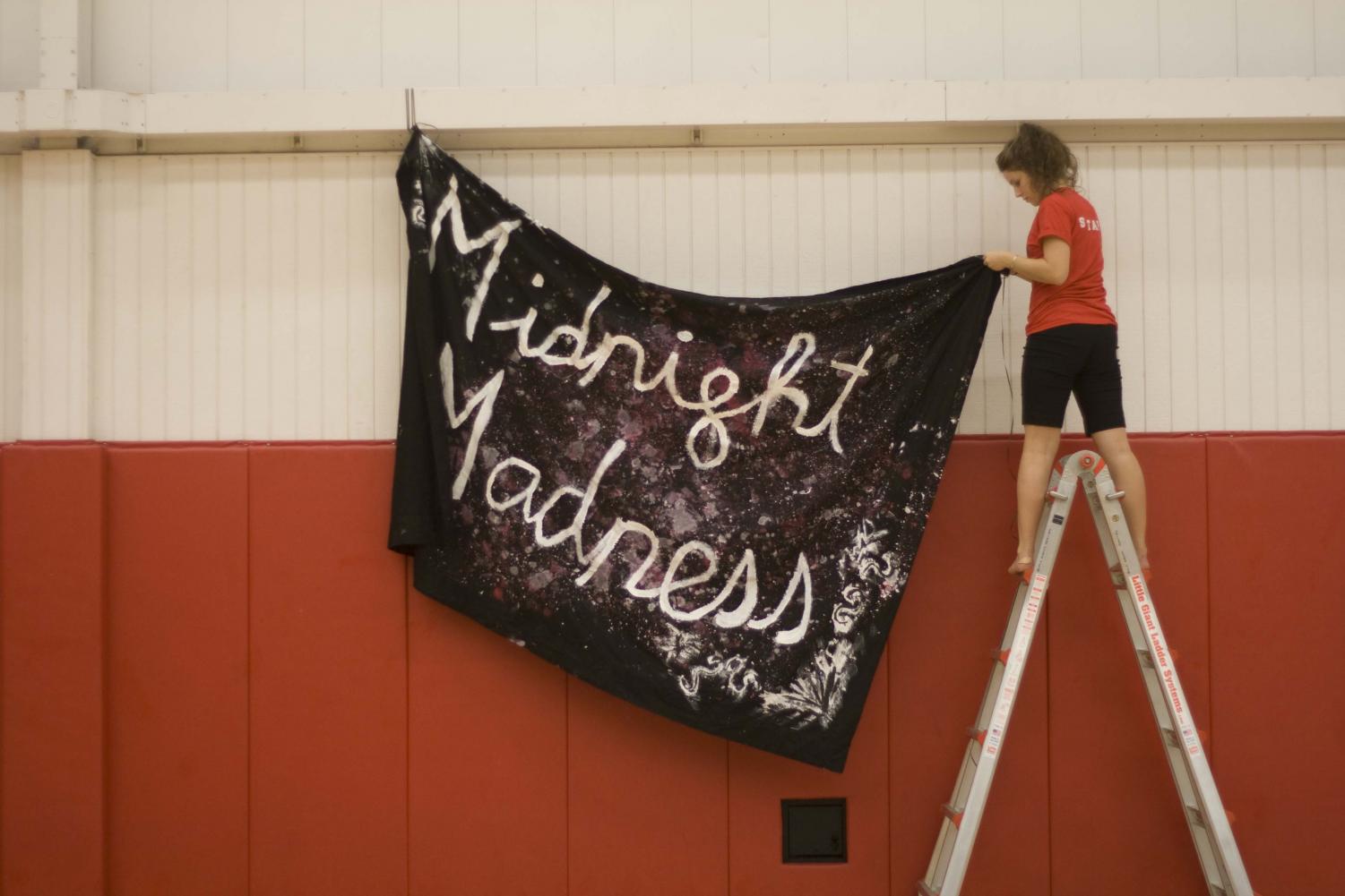 Students decorated the gym with red and black paraphernalia in preparation for the crowds that came in at 10:30.