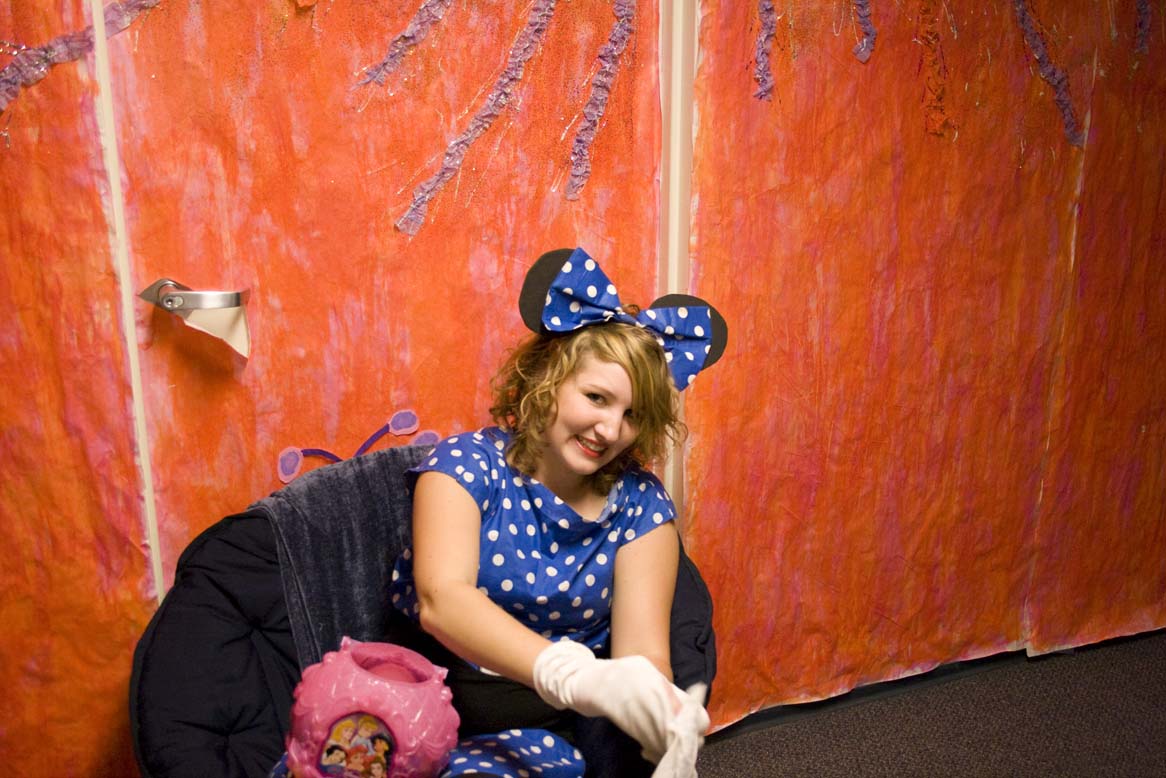 Freshman Hannah Pearsey, sat outside her giant gumdrop door at Alpha's Candyland event on Wednesday night. Dressed as mini mouse, she played Disney music and handed out candy to the trick-or-treaters.