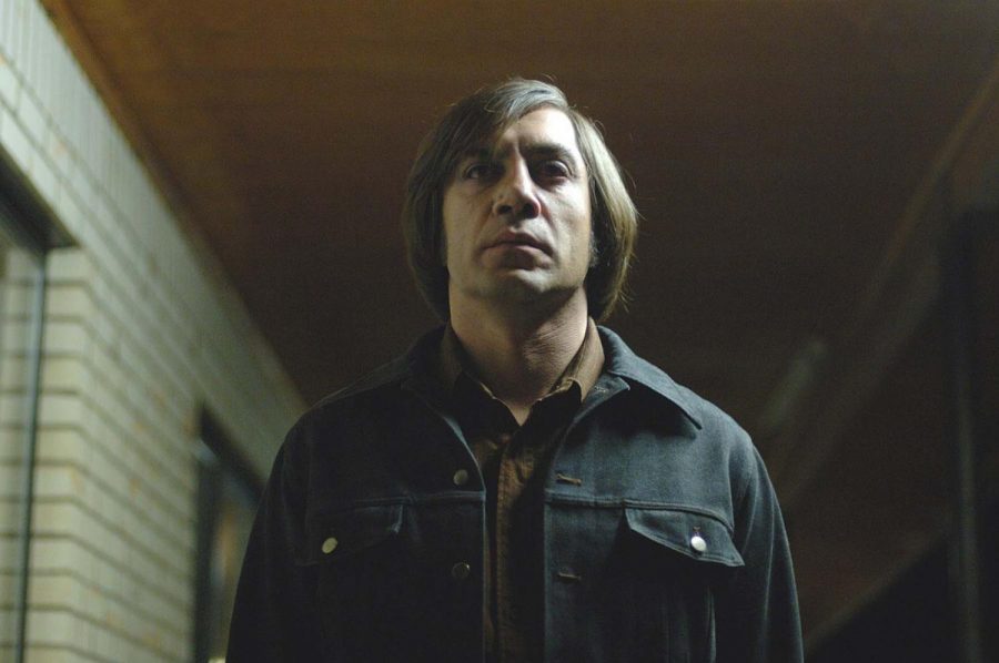 Javier Bardem, playing Anton Chigurh, in a movie about violence and mayhem. After a hunter discovers dead bodies, drugs and more than $2 million in cash near the Rio Grande.