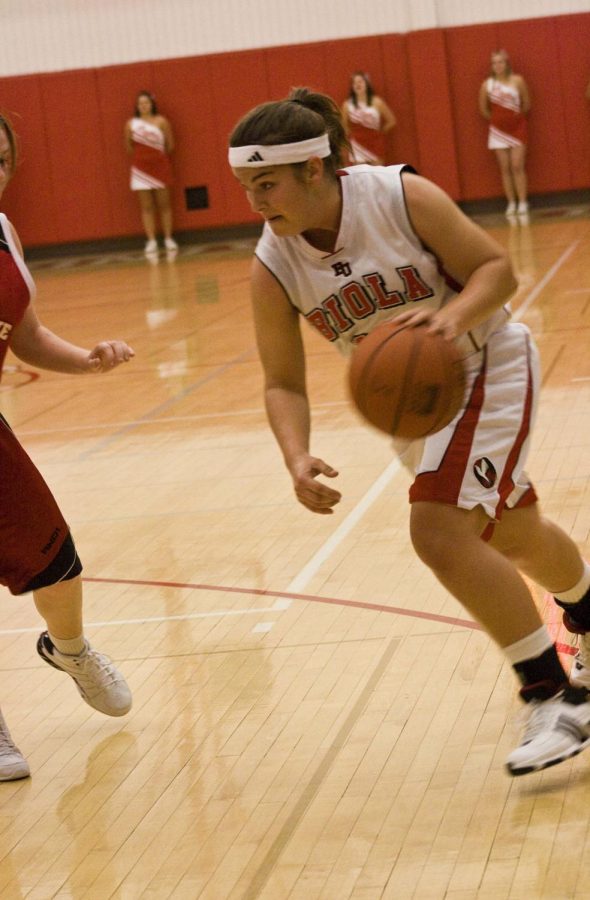 Sophomore guard Elise Paty drives to the basket in a home exhibition game against Melbourne Roos at the start of the season. The women’s basketball team returns home for a four-day stand beginning Thursday the 29th.