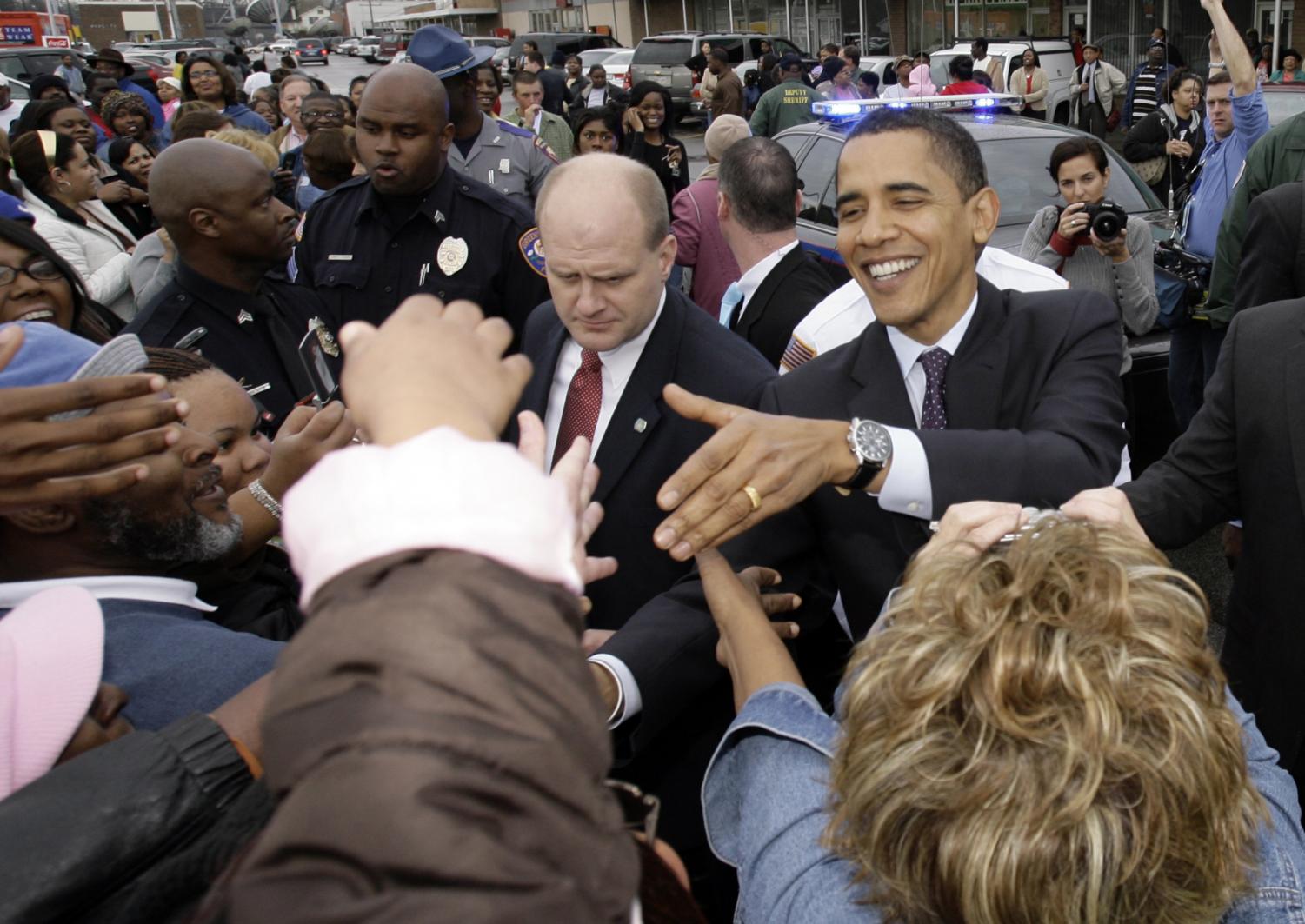 Democratic presidential hopeful, Sen. Barack Obama D-Ill., shakes hands after stopping at Buck's Restaurant for breakfast, Tuesday, March 11, 2008, in Greenville, Miss.