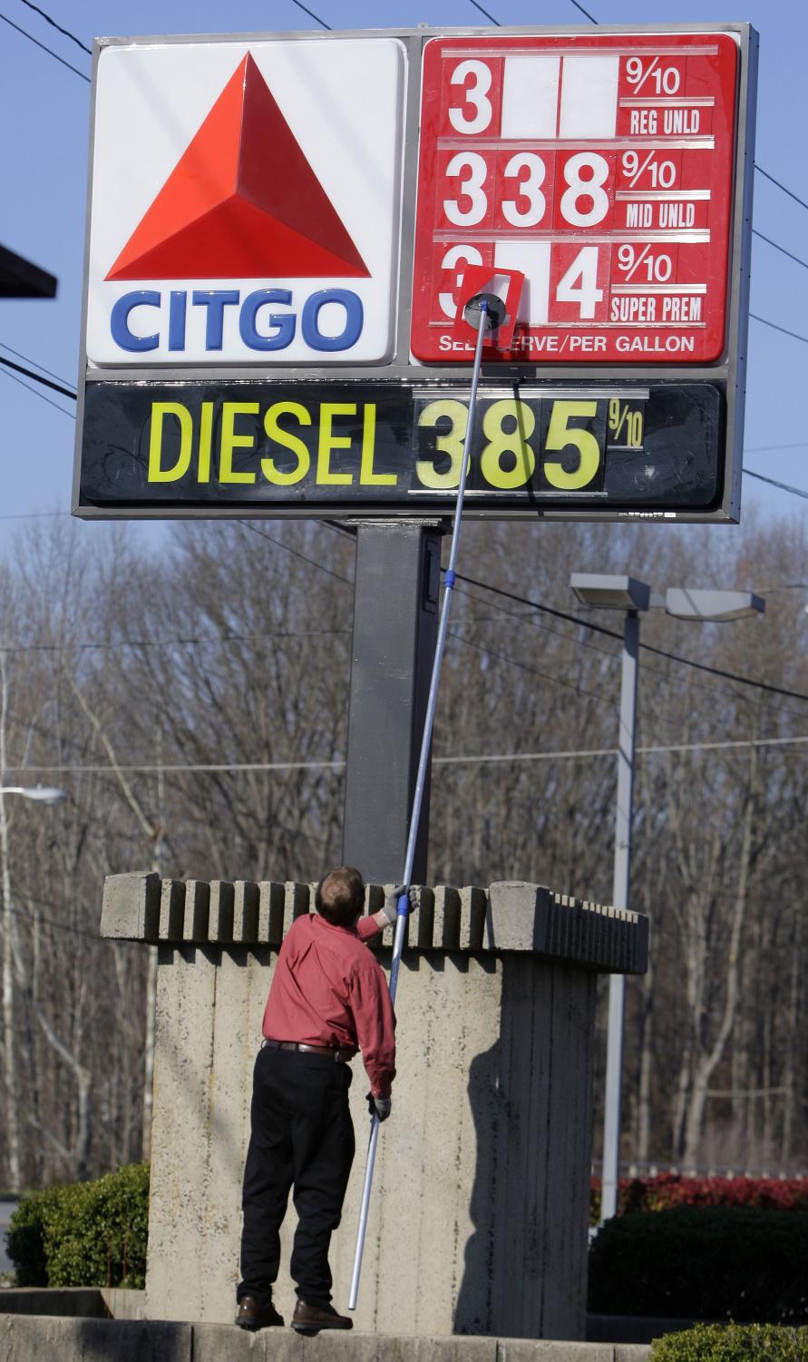 Bruce South, manager of a Citgo gas station, lifts up another number to change the price of his gas Monday, March 10, 2008 in Statesville, N.C. South said that he had changed his gas prices four times in the last two weeks, always increasing in price. Oil prices pulled back Monday as traders booked profits after last week's record highs and amid easing tension between oil producers Venezuela and Colombia over the weekend.