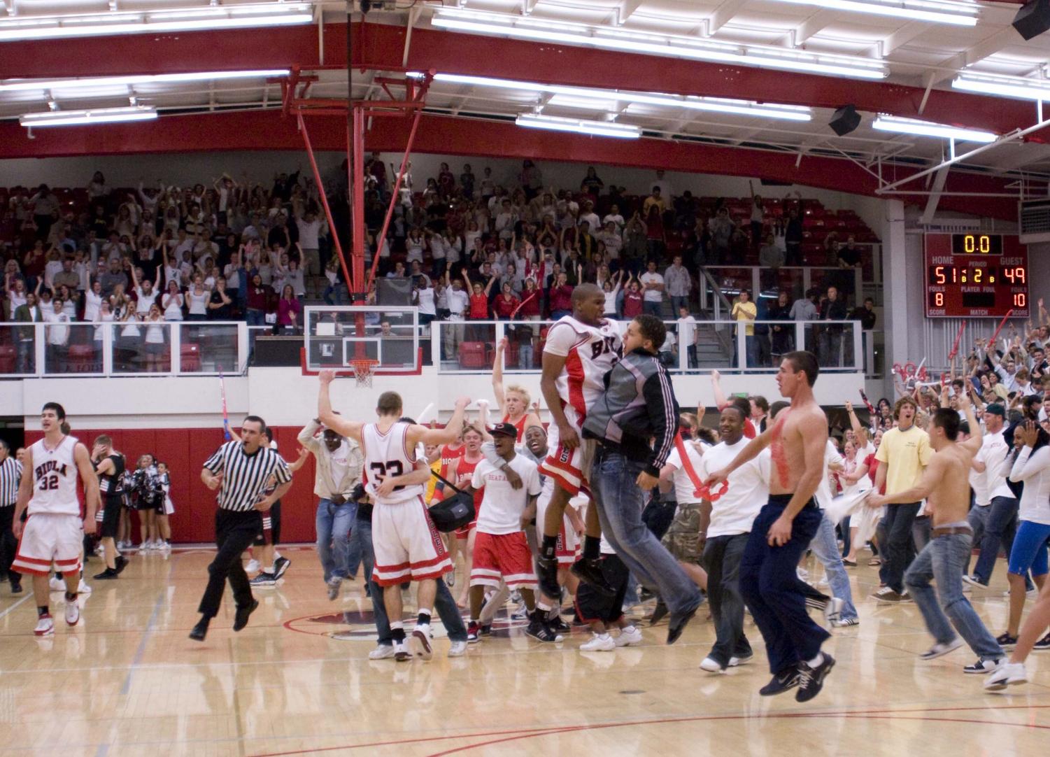 The moment the clock ran out, fans rushed onto the court and excitement filled the gymnasium in celebration on the Biola victory in Monday night's Biola vs. APU basketball game.