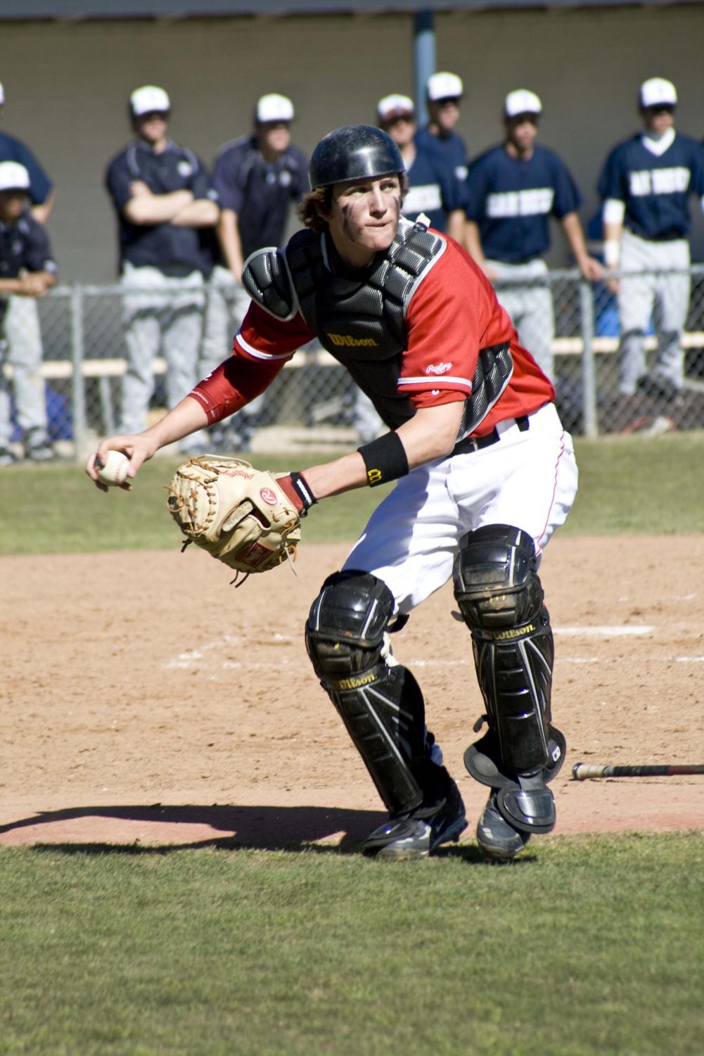 Sophomore Daniel Bodemer, throws to first after a strikeout during last Monday's game against Bethany University.