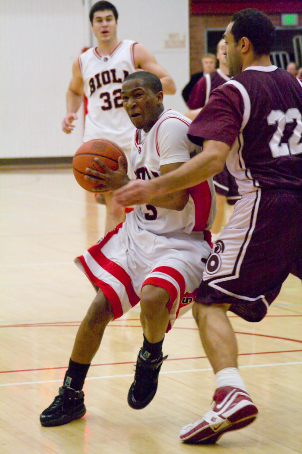 Sophomore Guard Marlon King fights his way through the opposing teams defense. King added 11 points during Saturday's game against Concordia.