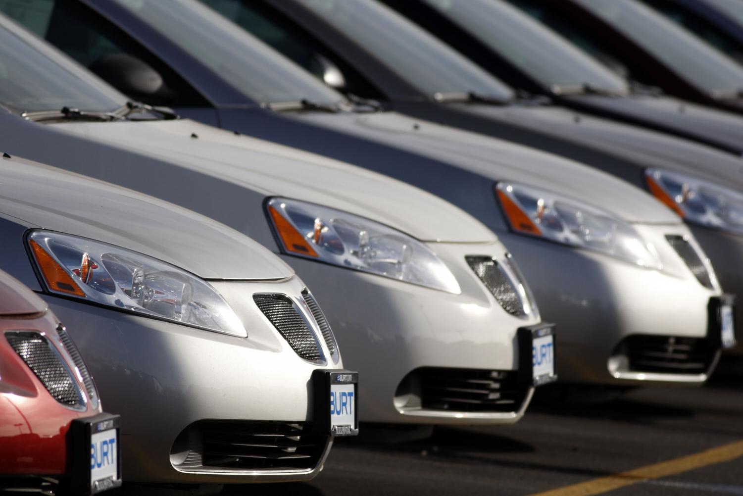 Unsold 2008 G6 sedans sit in a long row at a Pontiac dealership in Littleton, Colo., on Sunday, Jan. 27, 2008. General Motors Corp., the make of Pontiac, reported the largest annual loss for an automotive company Tuesday Feb. 12, 2008 and said it is making a new round of buyback offers to U.S. hourly workers as it struggles to turn around its North American business amid a weak economy.