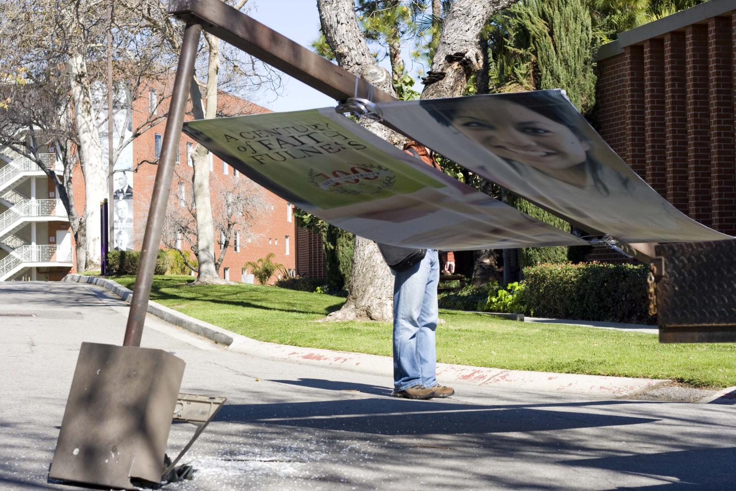 A light pole displaying a diversity banner fell outside the cafeteria at 1:45 on Tuesday afternoon.