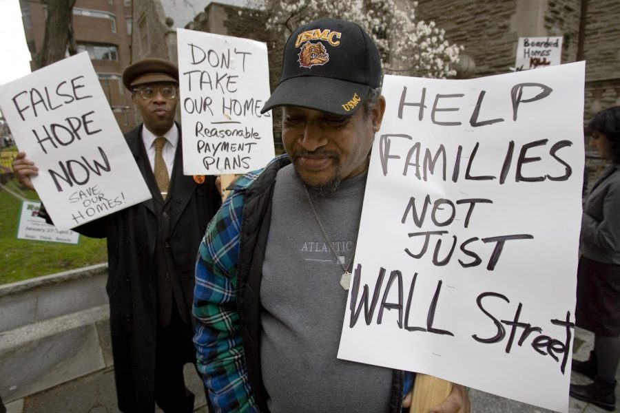 Joseph Barratt, 55, and others demonstrate outside a HOPE NOW home ownership preservation workshop at the University of Pennsylvania in Philadelphia, Tuesday, April 1, 2008. Demonstrators hoped to draw attention subprime mortgage crisis.