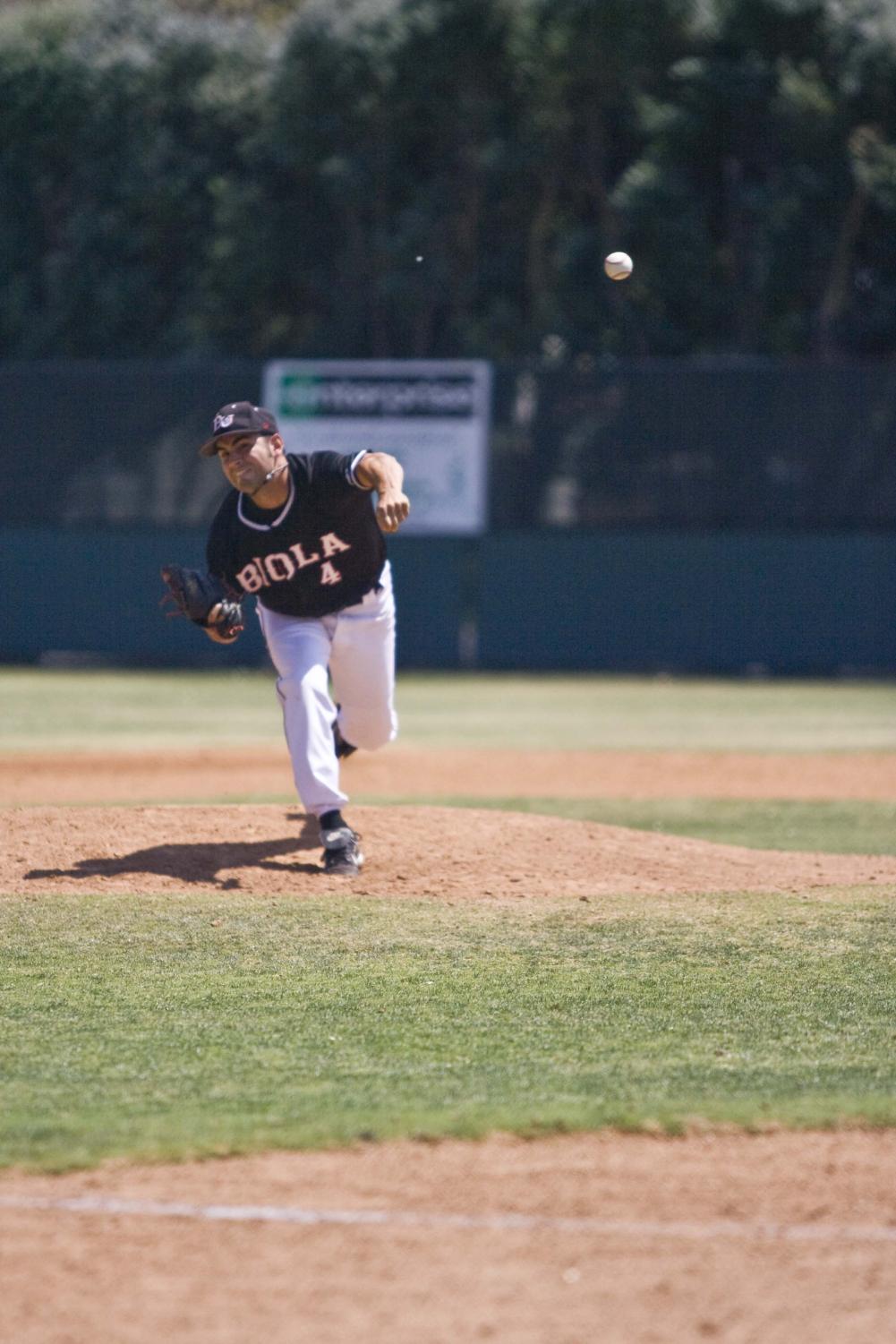 Senior Jimmy Johnson pitches against Azusa Pacific in one of the last regular season games of 2008.