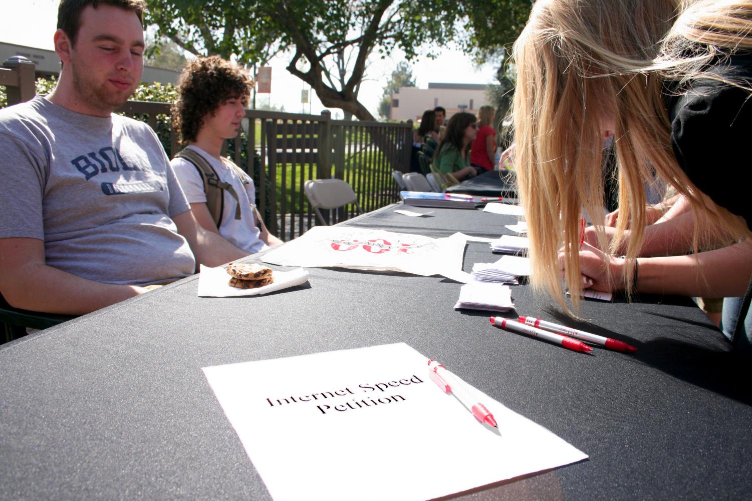 Monday, students Allan Bagge and Richard Norris sat outside the cafe in effort to gain support for a petition for better internet on the Biola campus.