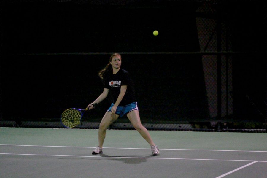 Freshman Emily Lee plays in the first tennis intramural match of the season Thursday night. Tennis is one of the new sports added to intramurals this semester. It is available to both men and womens singles and doubles.