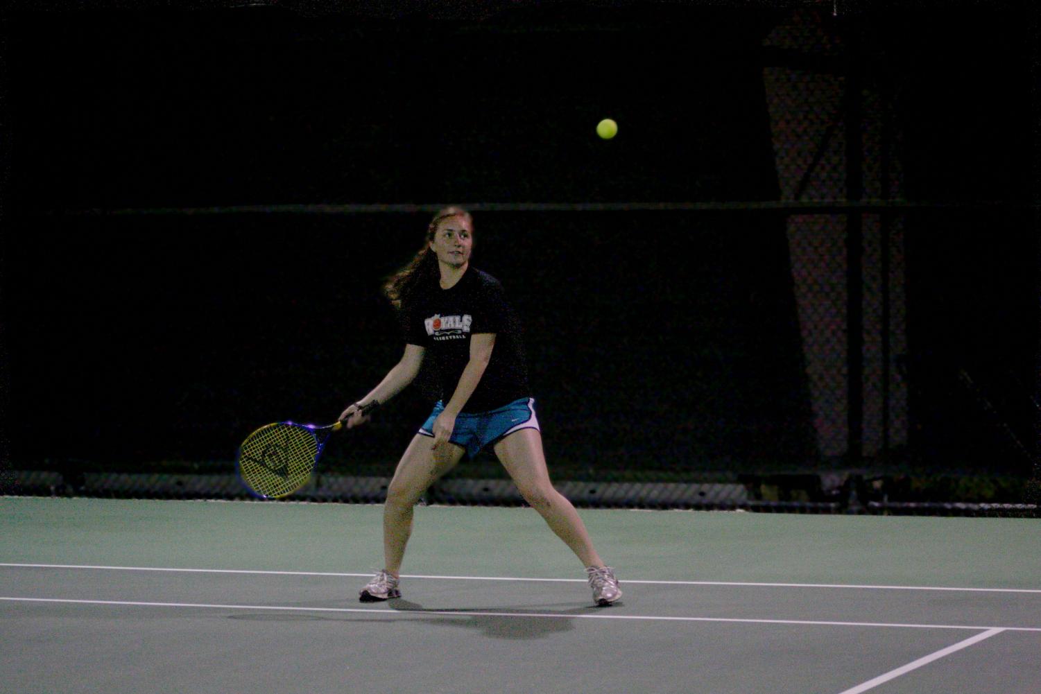 Freshman Emily Lee plays in the first tennis intramural match of the season Thursday night. Tennis is one of the new sports added to intramurals this semester. It is available to both men and women's singles and doubles.