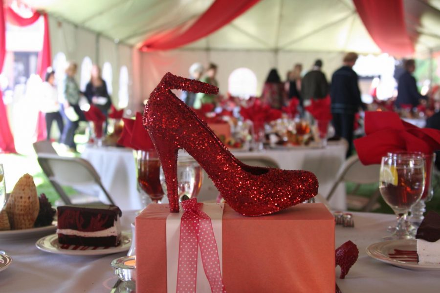 A wide variety of shoes covered in red glitter were the tables decorative centerpieces at the Ruby Slipper Luncheon on March 5.