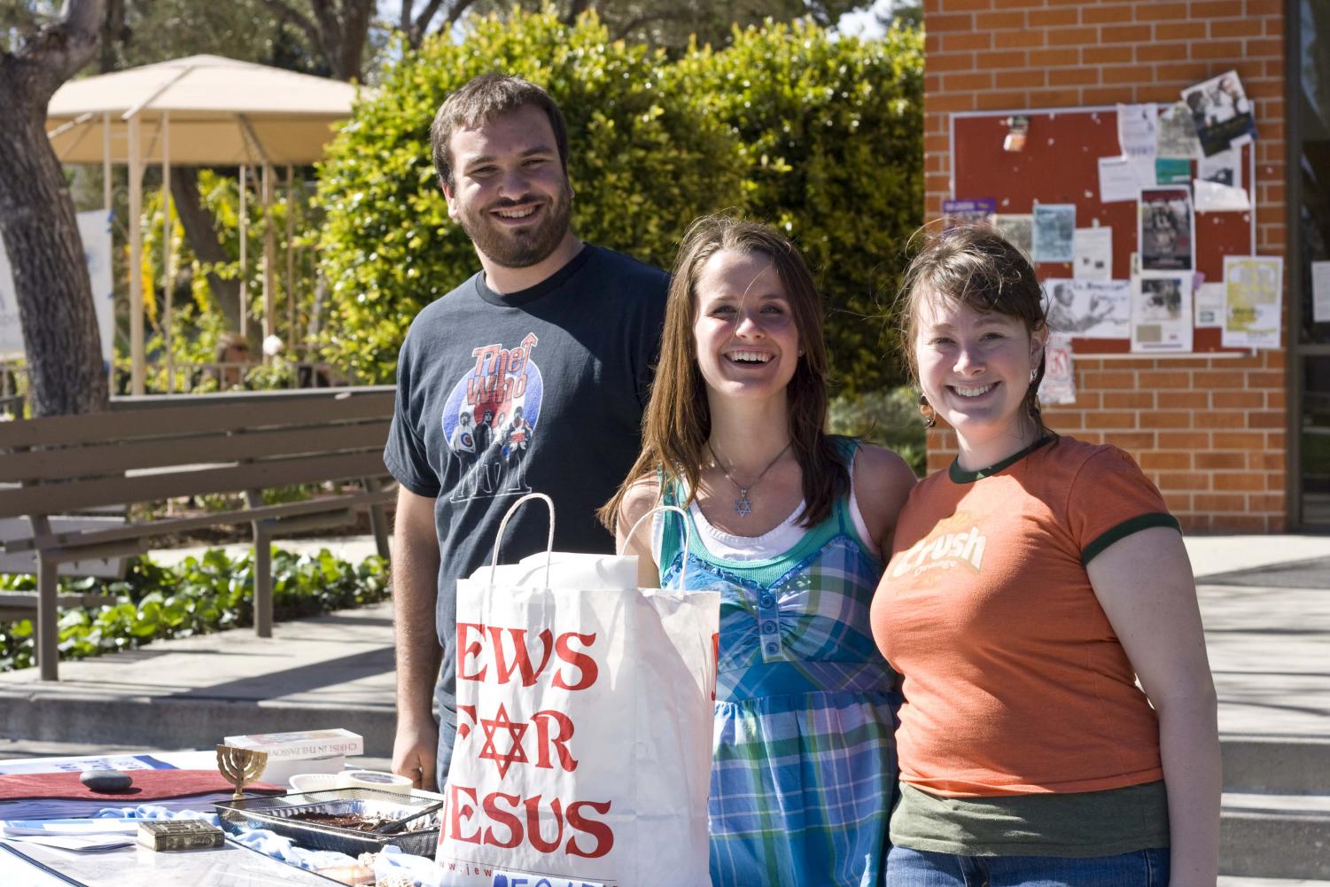 Sam Rood and Karen Myers stand by their 'Jews for Jesus' club table. The club is unique in that even those who aren't Jews can join.