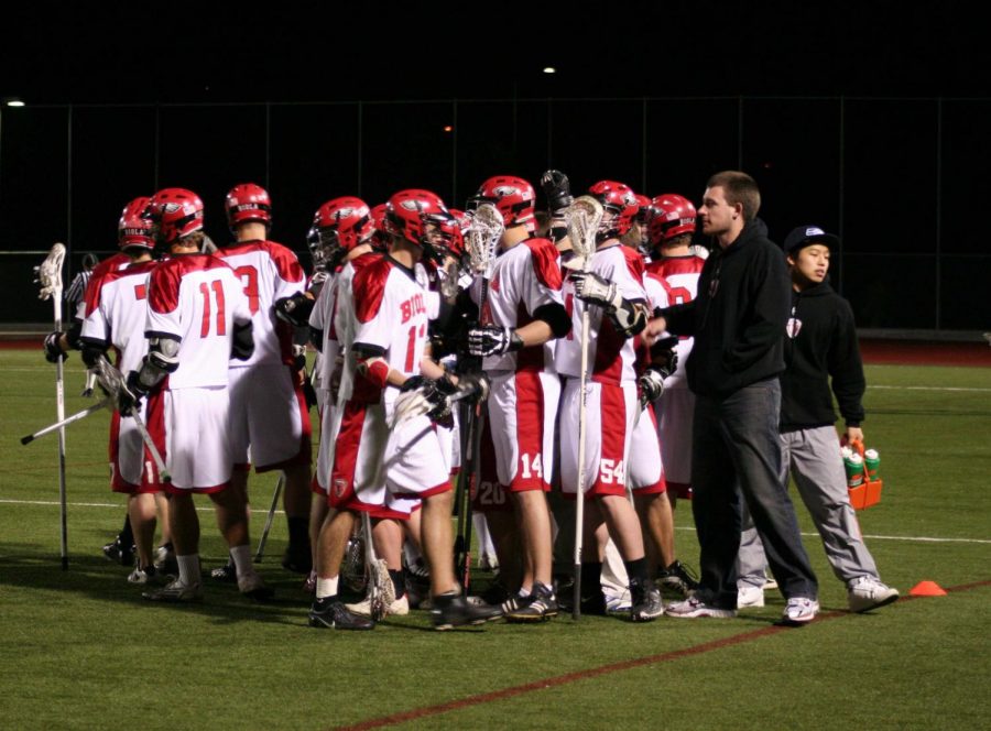 The+lacrosse+team+disbands+from+a+huddle+after+shouting+their+unofficial+motto+at+their+home+game+against+Concordia+University+on+Feb.+8.