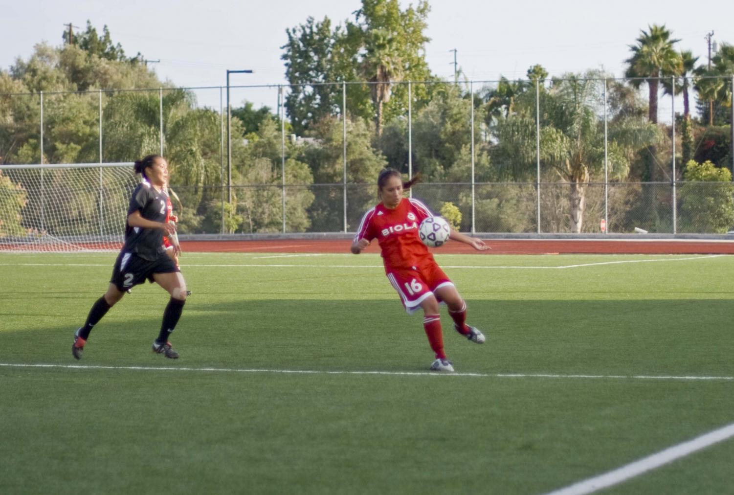 Freshman Brianna Yarber displays her ball handling skills while taking on an opponent from Azusa Pacific University.