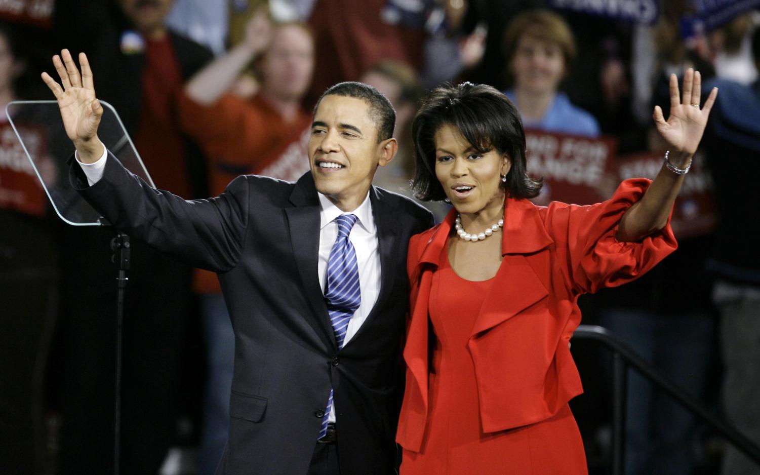 Democratic presidential hopeful Sen. Barack Obama D-Ill., and his wife Michelle wave to supporters at a Super Tuesday primary rally Tuesday, Feb.. 5, 2008, in Chicago, Ill.