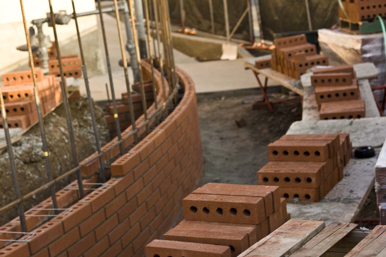 Bricks and mortar lay stacked at the back of the Production Center after a day of construction made possible by the anonymous donor.