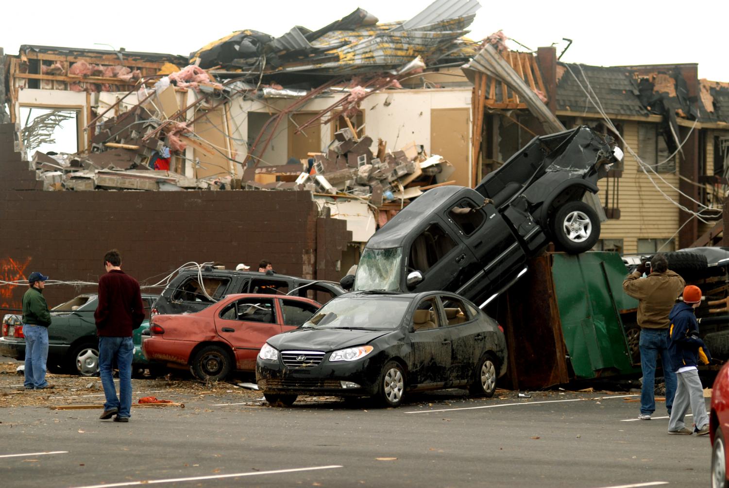 Students and their families survey tornado damage around campus dormitories at Union University on Wednesday, Feb. 6, 2008 in Jackson, Tenn. The storm, which hit Tuesday night, collapsed buildings, flipped cars and sent about 50 students to the hospital.