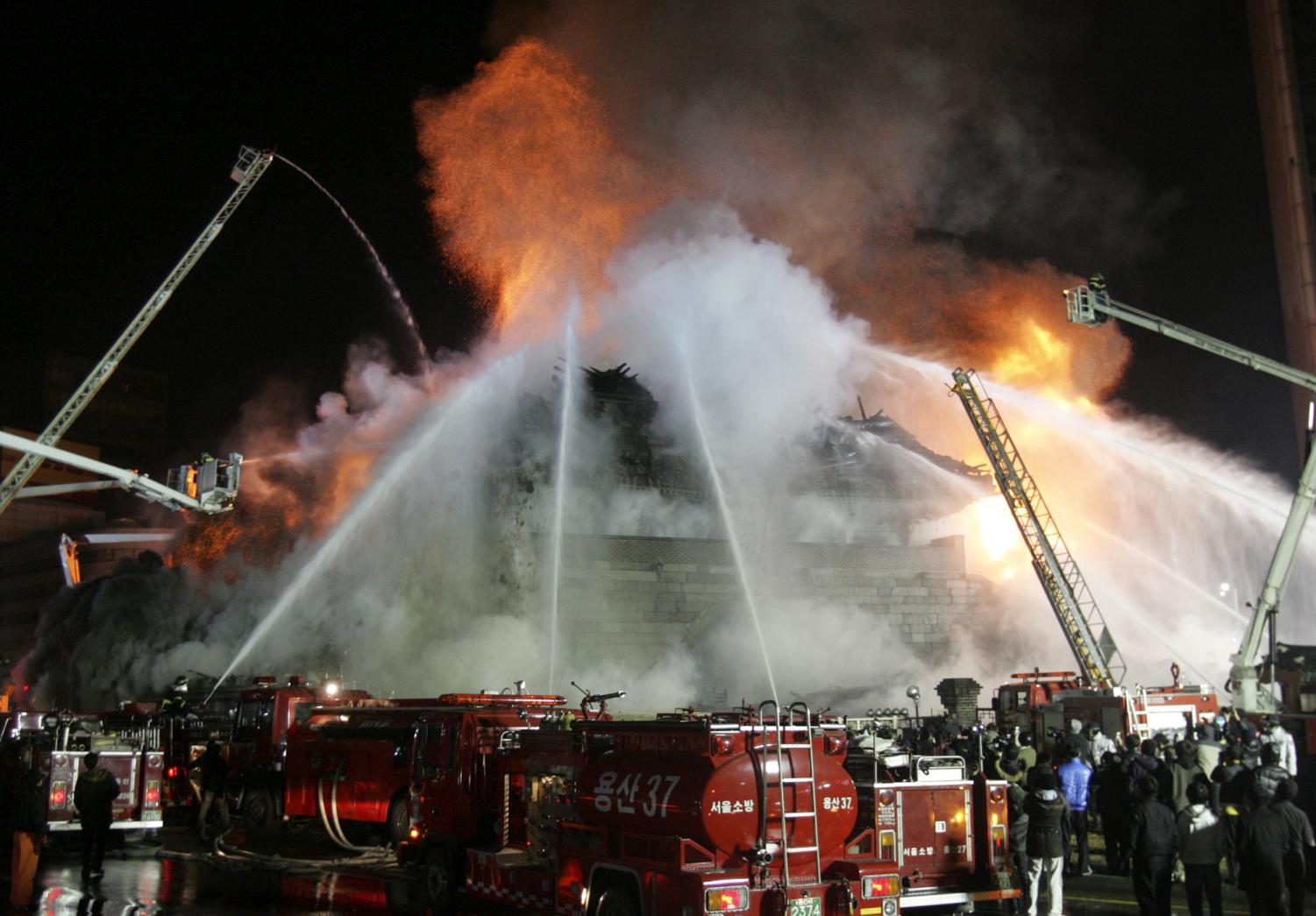 South Korea's " No. 1 national treasure" Namdaemun breaks down as firefighters extinguish a fire in Seoul, South Korea, Monday, Feb. 11, 2008. Namdaemun, literally 'the great southern gate,' was the southern gate of the original walls surrounding Seoul during the Joseon Dynasty. The construction of this gate began in 1395.