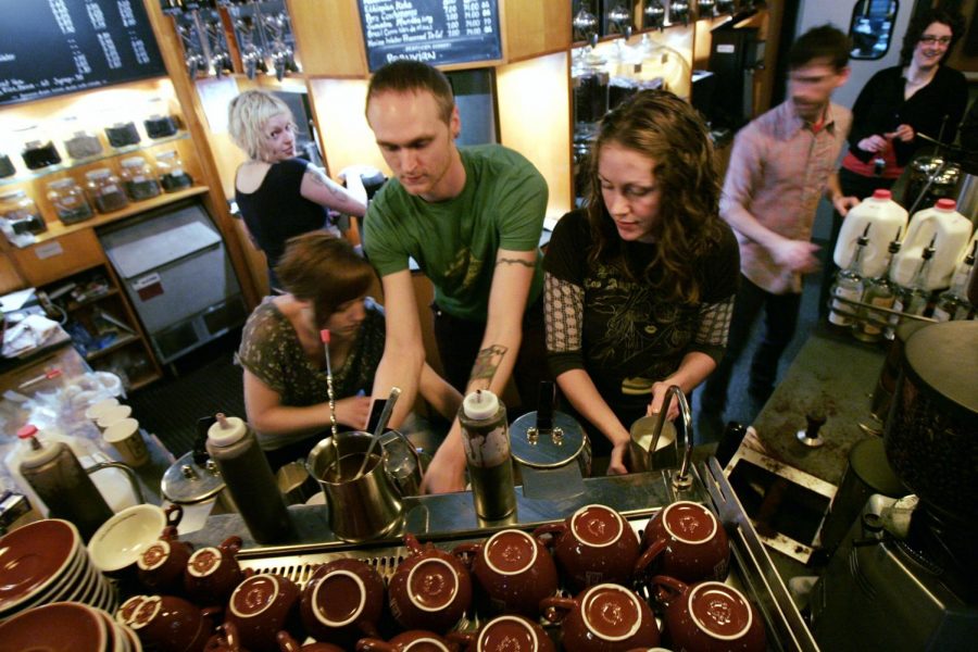 Baristas crowd together as they make espresso drinks for an overflowing crowd at Caffe Vita Coffee Roasting Co. Tuesday, Feb. 26, 2008, in Seattle. The small chain, with four shops in Seattle, was giving away free espresso drinks while the world's largest gourmet coffee retailer shuts its doors. Starbucks stores closed for three-hour nationwide training sessions Tuesday evening, leaving caffeine junkies to look elsewhere for their fix.