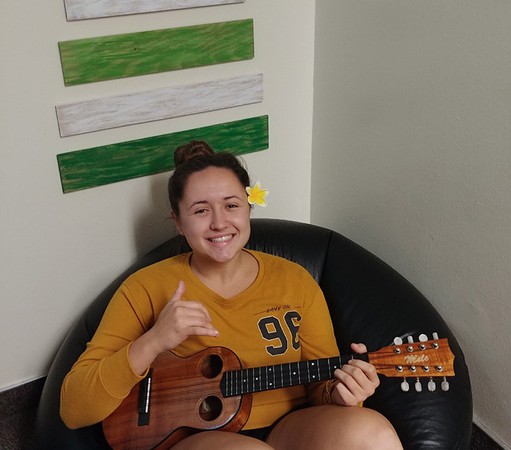 A picture of Beka Revelle holding an ukulele