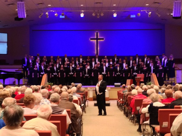 Todd Guy conducts a choir