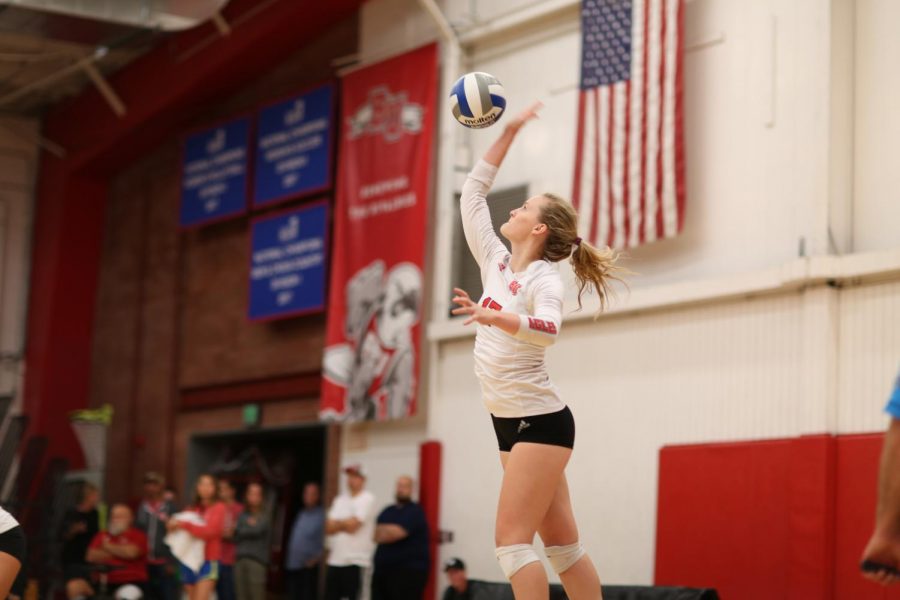 Sophomore middle blocker Bekah Roth serves a ball during the Eagles game against Azusa Pacific University on Oct. 3, 2018.