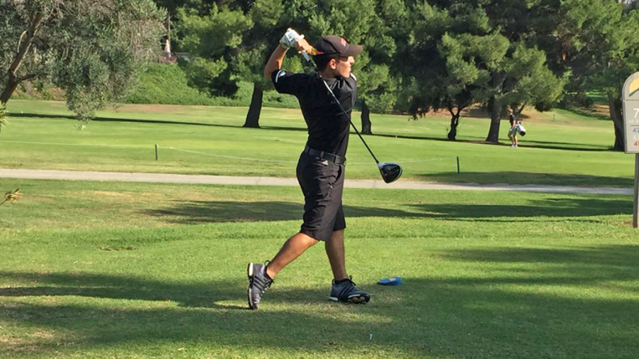 Senior Dominic Ariondo tees off during the Eagles dual match against the University of La Verne on Nov. 7.