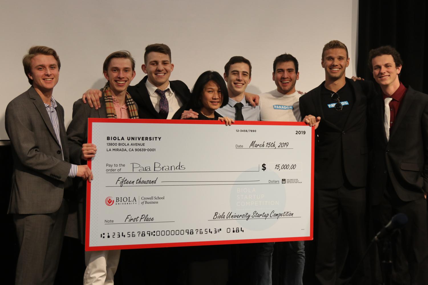 The parabrands team receives their first-place check