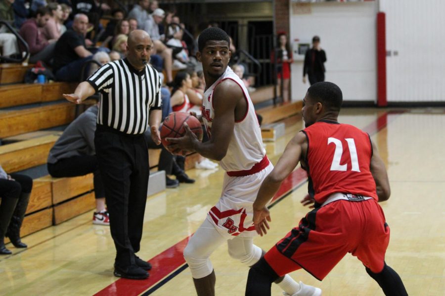 Sophomore guard Alex Wright looks to advance the ball into the paint.