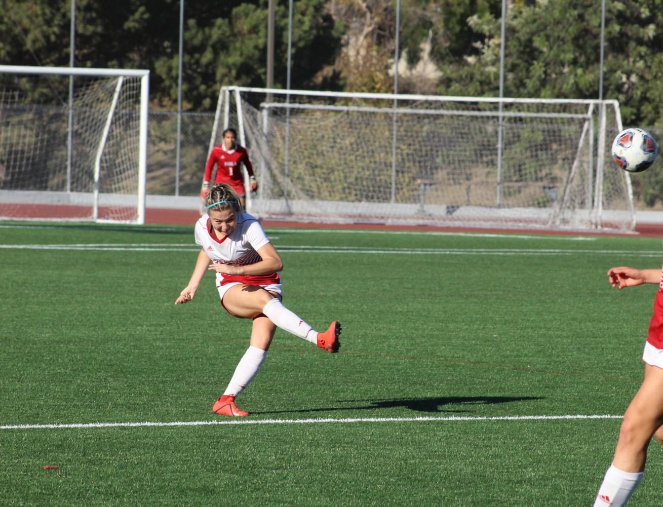 Senior Alyssa Chaves punts the ball. 