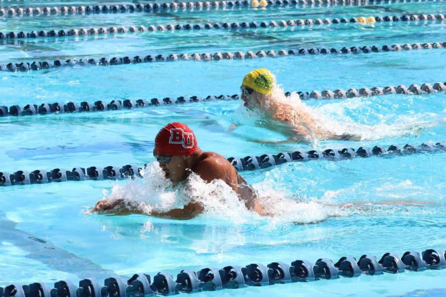 Biola swimmers compete to win in the pool.  