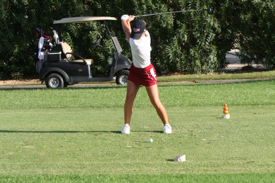 Biola golfer swings at the ball during the Sonoma State Invite. 